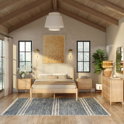 Neutral Scandinavian bedroom interior with vaulted wood ceiling, light wood platform bed, matching nightstands and dresser, large black-framed windows, fiddle leaf fig plant, woven table lamp, abstract gold wall art and blue striped area rug — cozy minimalist master bedroom design