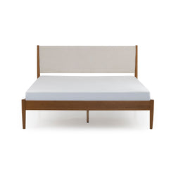 Mid-century modern walnut wood platform bed frame with beige upholstered headboard and white mattress, minimalist contemporary bedroom furniture