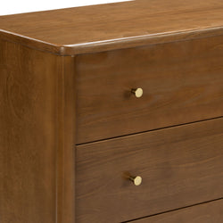 Mid-century modern walnut dresser with three drawers, brass knob handles and smooth warm wood finish