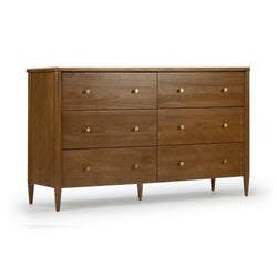 Mid-century modern six-drawer walnut dresser with tapered legs and brass knob pulls, warm wood finish bedroom storage