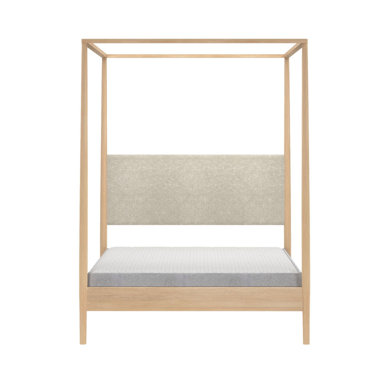 Minimalist light oak four-poster canopy bed with beige upholstered headboard and gray mattress on white background