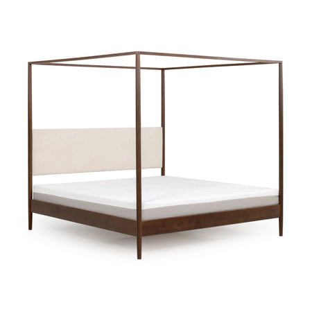 Modern walnut four-poster canopy bed with beige upholstered headboard, minimalist wooden platform frame and white mattress