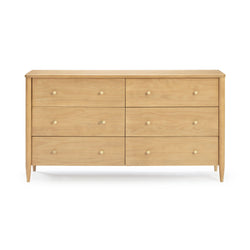 Mid-century modern light wood 6-drawer bedroom dresser with tapered legs and round knob pulls in a natural wood finish