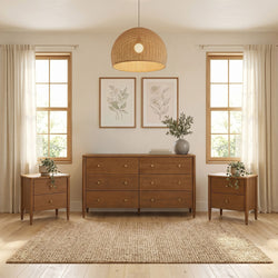 Neutral Scandinavian bedroom interior with mid-century wooden dresser and matching nightstands, woven rattan pendant light, botanical framed art, sheer curtains, jute rug and potted plants