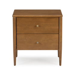 Mid-century modern two-drawer walnut nightstand with brass knobs and tapered legs on white background
