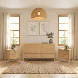 Light-filled Scandinavian bedroom with natural wood dresser and nightstands, woven rattan pendant light, neutral curtains, botanical wall art, potted plants and jute rug