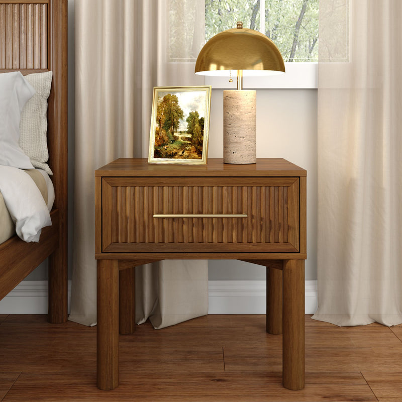 Modern wooden nightstand bedside table with grooved drawer, gold dome table lamp and framed landscape for bedroom decor