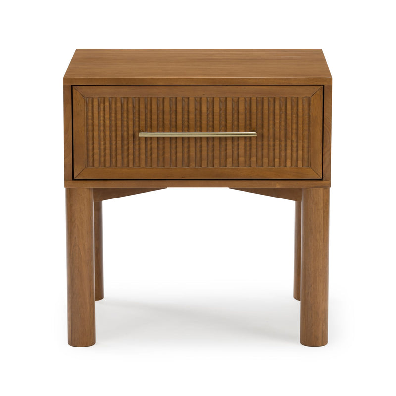 Mid-century modern walnut nightstand with ribbed drawer front, brass bar handle and round wooden legs on white background