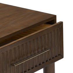 Close-up of dark brown wooden bathroom vanity cabinet with partially open drawer, ribbed front panel and brushed metal towel bar, rustic wood grain top