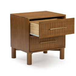 Close-up of mid-century modern walnut wooden nightstand with fluted drawer fronts, brass bar handles, round legs and an open drawer