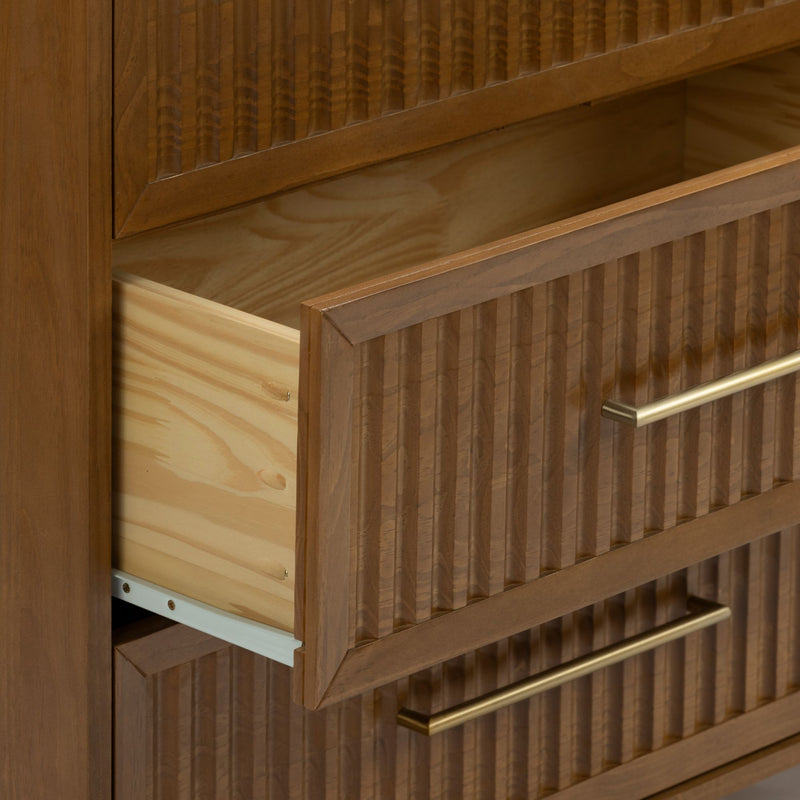 Mid-century modern wood dresser with fluted drawer fronts and brass bar handles, open drawer showing natural pine interior and metal drawer slides