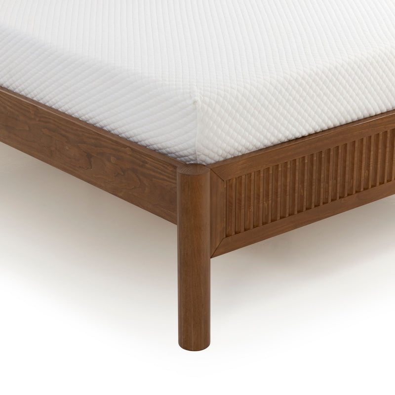 Walnut solid wood platform bed frame corner with vertical slatted footboard, round leg and white quilted mattress