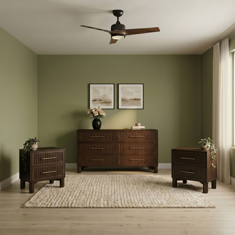Modern living space with three-blade wood ceiling fan, olive green accent walls, mid-century walnut dresser, framed art, vases and textured rug