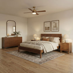 Modern neutral bedroom interior with wooden slatted bed frame, matching dresser and nightstand, ceiling fan with light, beige bedding and framed wall art
