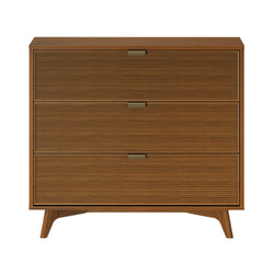 Mid-century modern walnut three-drawer dresser with ribbed drawer fronts and brass handles on tapered legs