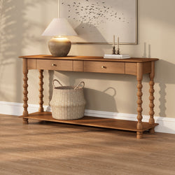Wood console table with turned legs, ceramic lamp, candlesticks and woven basket on oak hardwood floor — neutral entryway decor