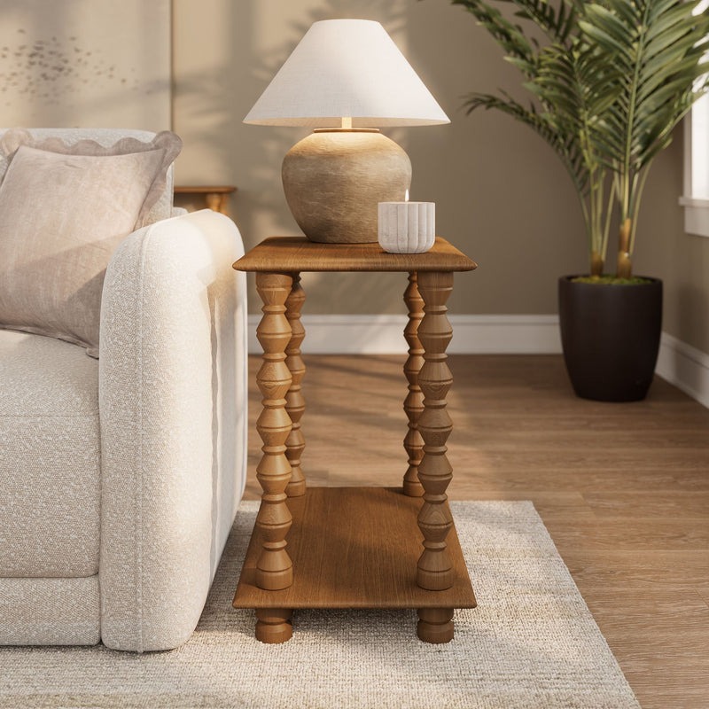 Neutral living room interior with beige sofa, wooden turned-leg side table, ceramic table lamp and decorative candle — cozy modern farmhouse decor