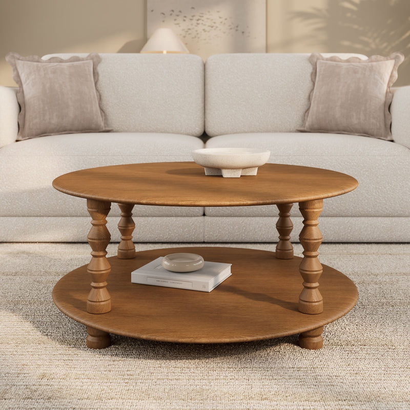 Modern neutral living room with round wooden coffee table and ceramic bowl, beige sofa with scalloped throw pillows and textured area rug