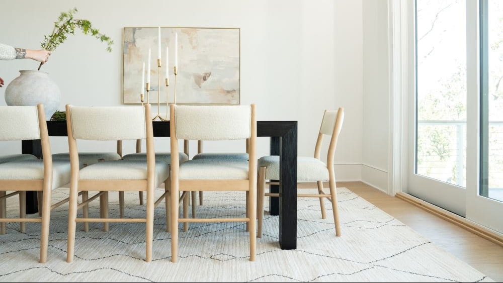 Blonde coffee table with red holiday accent decor.