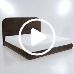 Modern brown upholstered platform bed with white mattress and rounded fabric headboard — contemporary bedroom furniture