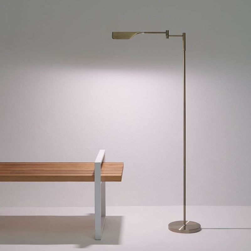 Modern minimalist floor lamp beside contemporary wooden bench in a clean, elegant interior.