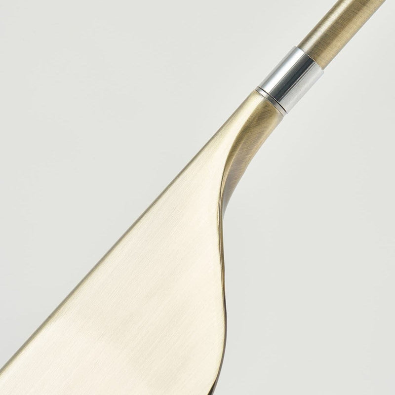 Close-up view of a modern metal spoon with a sleek and minimalist design.