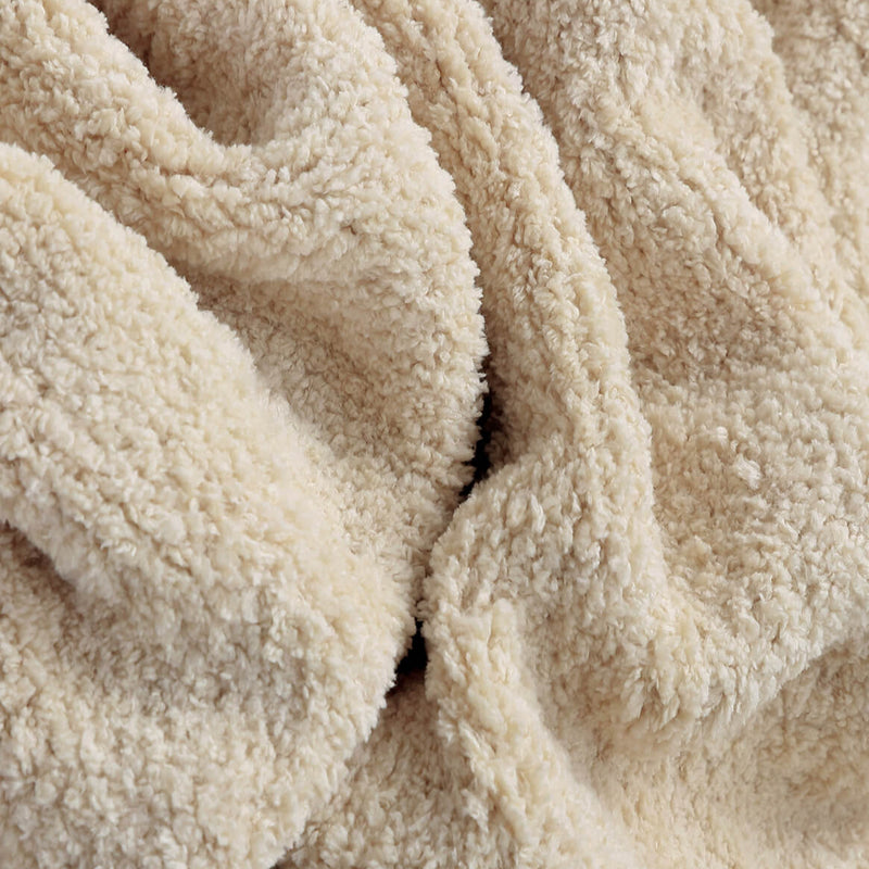 Cozy beige fleece fabric texture perfect for winter blankets and crafts.