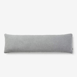 Gray body pillow with textured cover for comfortable and stylish bedding.