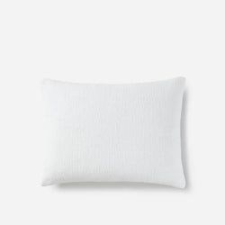 White pillow on a plain background, premium cotton cover for comfortable and restful sleep.