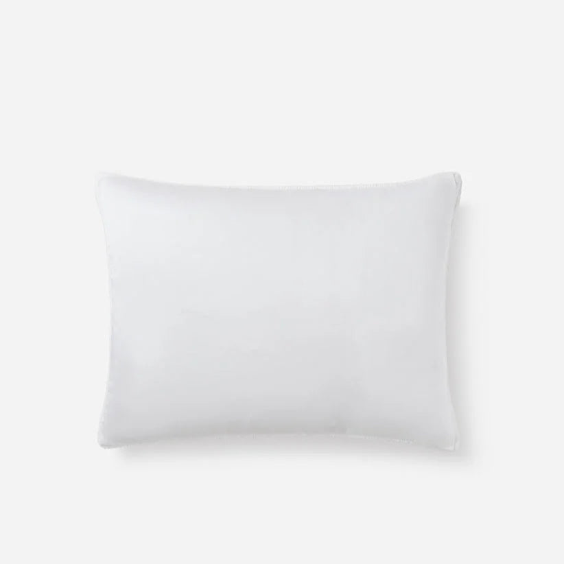 White hypoallergenic pillow on plain background.