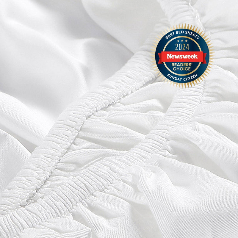 Award-winning white bed sheet by Sunday Citizen, recognized as best in 2024 by Newsweek, close-up view showcasing premium quality and soft texture.