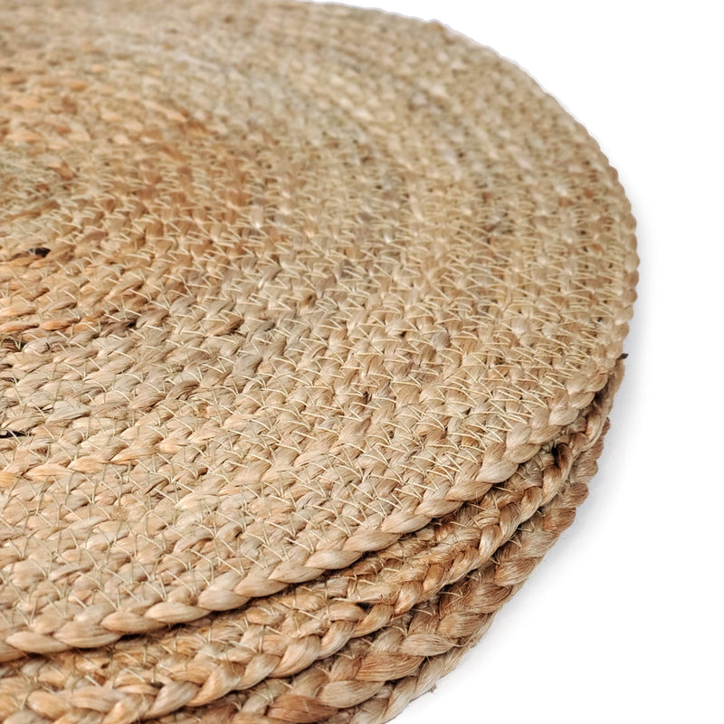 Natural woven jute placemats with rustic texture for eco-friendly home decor.