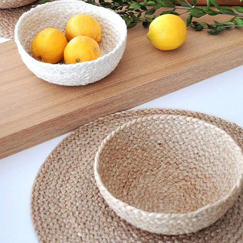 Handmade woven baskets with fresh lemons on a wooden table, perfect for rustic home decor.