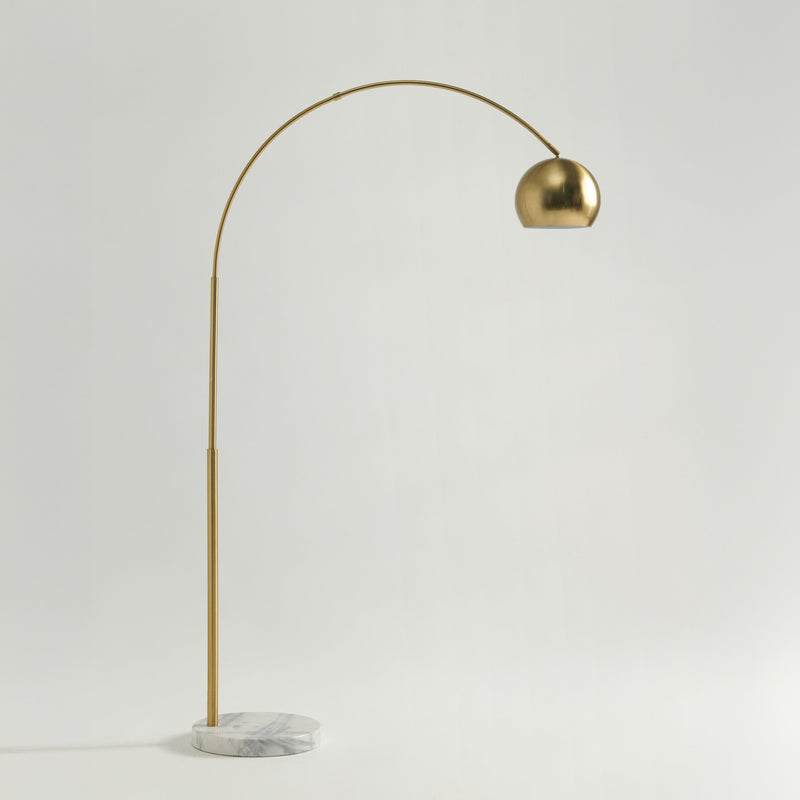Elegant gold arc floor lamp with a marble base, minimalist modern home lighting solution.