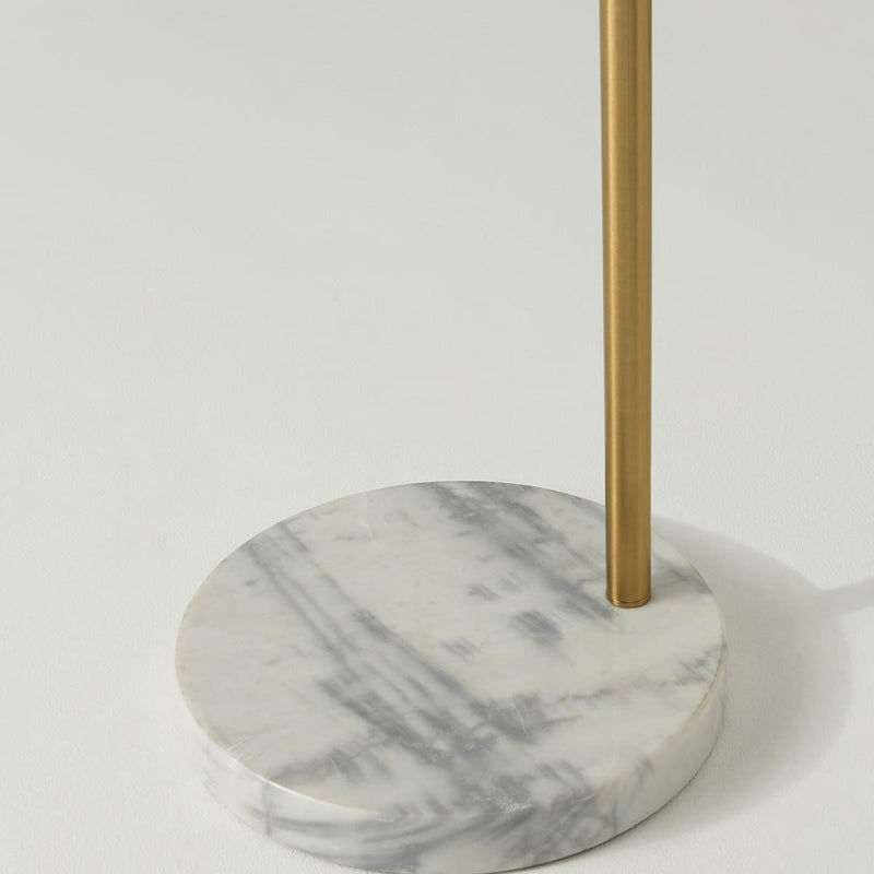 Marble base with elegant brass rod, perfect for modern floor lamp designs.