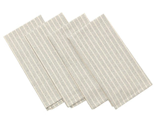 Set of beige striped linen napkins on a white background.