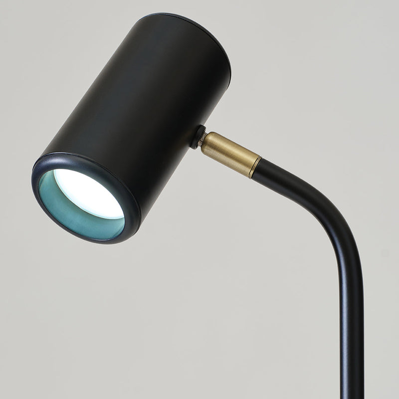 Modern black adjustable desk lamp with minimalist design for interior lighting.