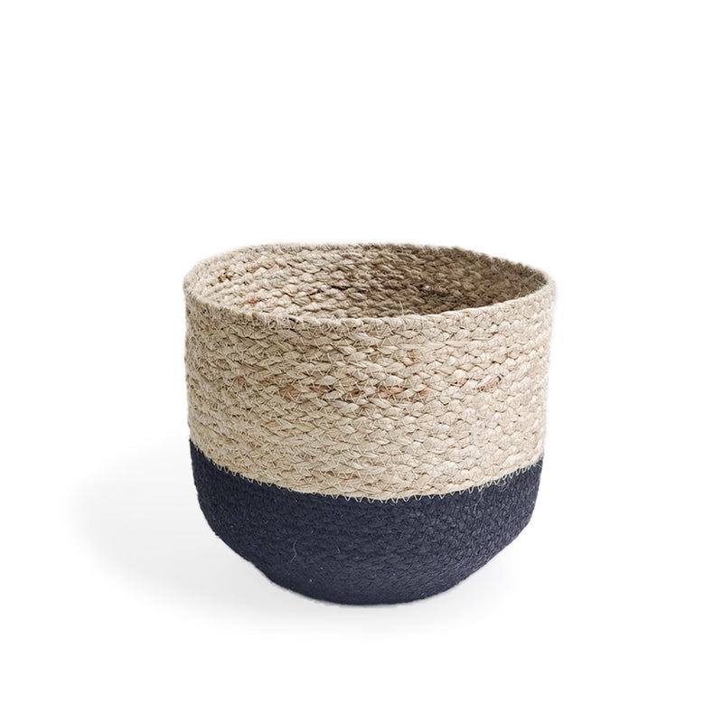 Natural woven basket with black stripe, ideal for home storage solutions.