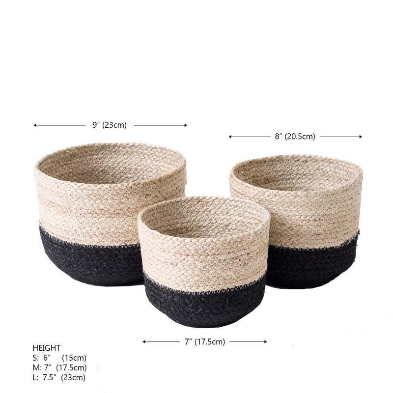 Set of three decorative seagrass baskets in varying sizes with black accents for stylish home storage solutions.