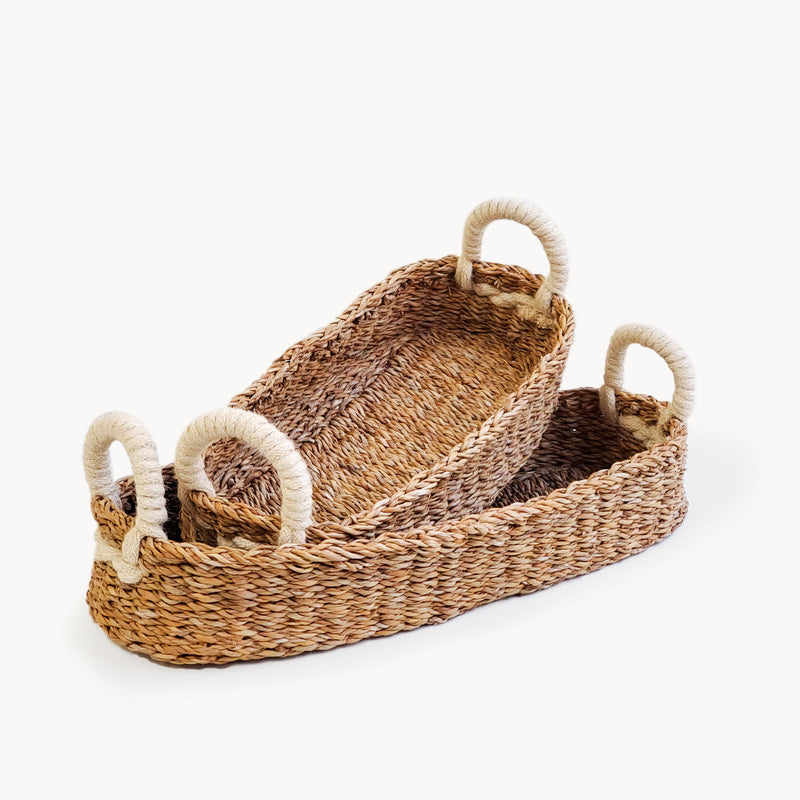Two natural woven baskets with handles, ideal for stylish home storage solutions.
