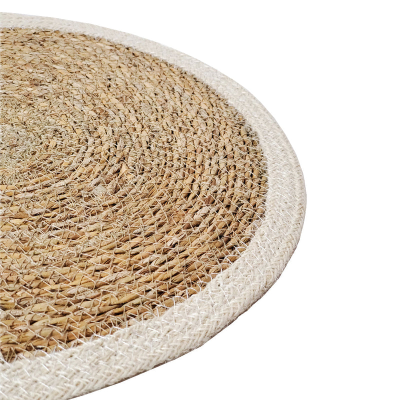 Round natural woven jute rug with beige border, eco-friendly home decor.