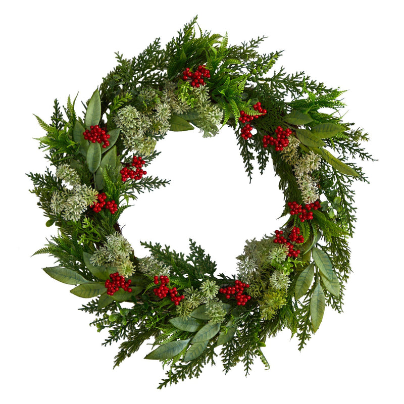 Classic Christmas wreath with mixed evergreen foliage and clusters of bright red berries on white background — holiday front door decor