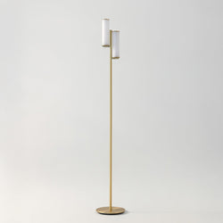 Modern brass floor lamp with two white cylindrical shades, minimalist mid-century design for living room or reading nook