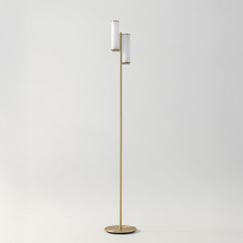 Modern brass floor lamp with two white cylindrical shades, minimalist mid-century design for living room or reading nook