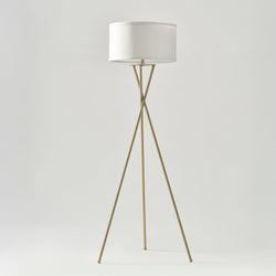 Modern brass tripod floor lamp with white drum fabric shade, minimalist living room and bedroom lighting