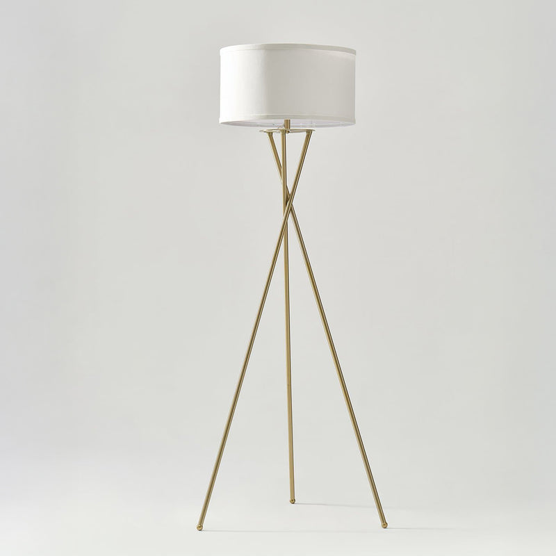 Modern brass tripod floor lamp with white drum fabric shade, minimalist living room and bedroom lighting