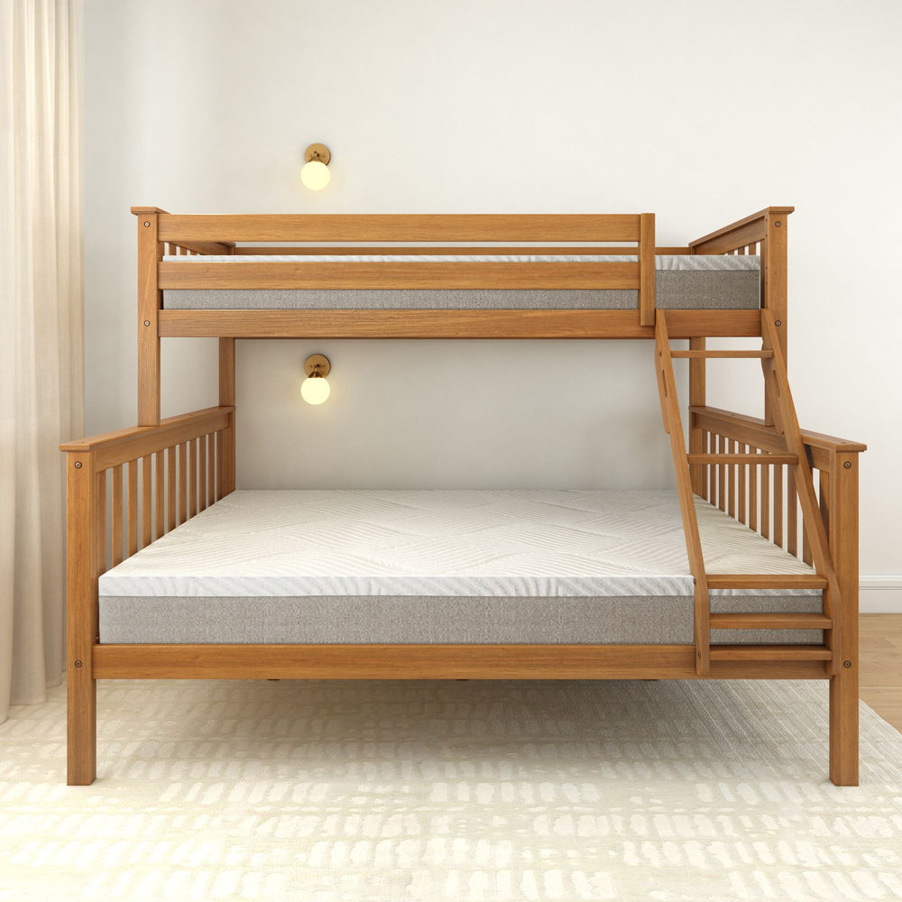 Wooden twin over full bunk bed with ladder in modern bedroom setting.