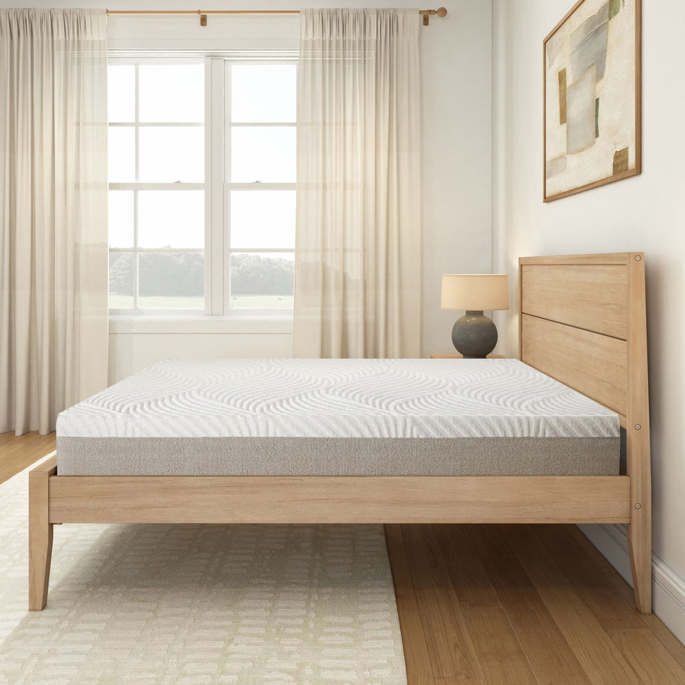 Modern minimalist bedroom with wooden bed frame and comfortable mattress in bright natural lighting.
