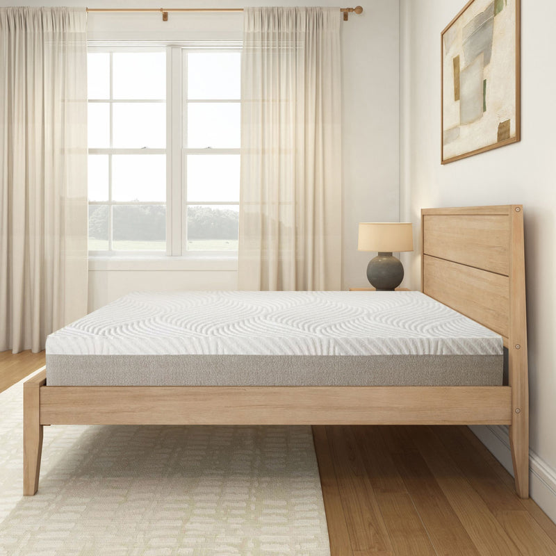 Modern minimalist bedroom with wooden bed frame and comfortable mattress in bright natural lighting.