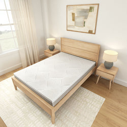 Modern bedroom with wooden bed frame and comfortable mattress, featuring minimalist nightstands and soft lighting.